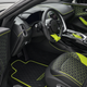 The interior of the Mansory DB is black with lime green detailing